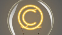 bulb with glowing copyright sign inside of it, creativity concept